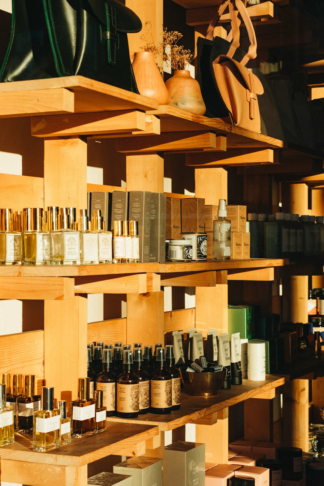 Conclusion: The Ever-Evolving Face of Beauty Success by Makeup Brands bottles on brown wooden shelf
